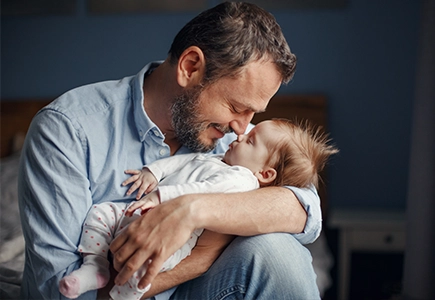 adult holding a baby