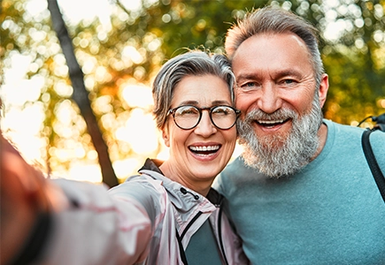 two middle age adults taking a selfie