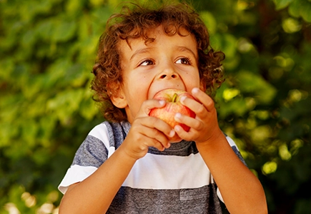 Pediatric Direct Primary Care/Pediatric DPC Child Eating an Apple