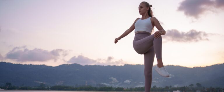 Woman exercising outdoors to support mental and physical health.