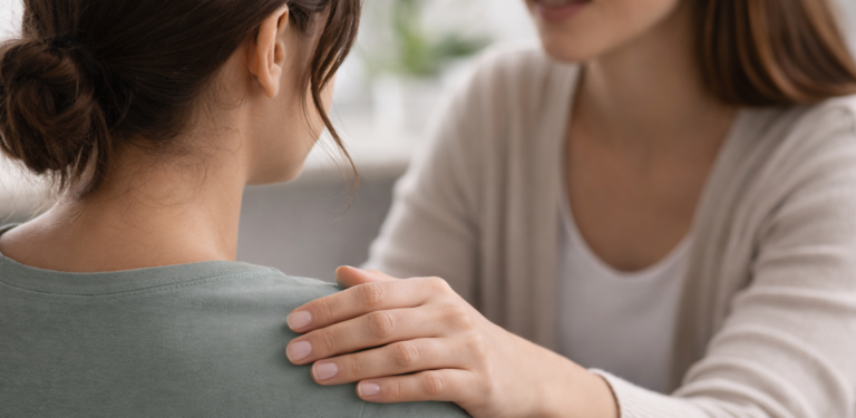 Primary care doctor speaking with a patient during a personalized visit at Two Eleven Health in Avon Lake